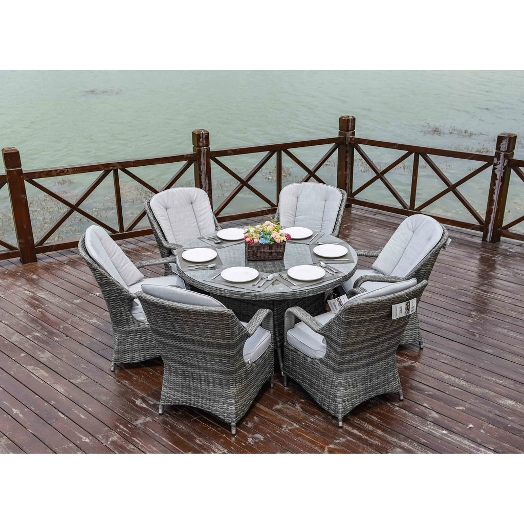 Set da pranzo rotondo da esterno in rattan intrecciato da 7 pezzi con cuscini di Moda Furnishings